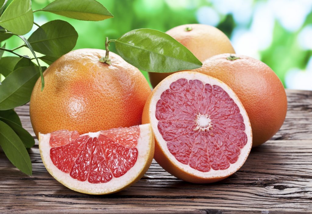 Grapefruits on a wooden table.