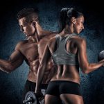 Athletic man and woman with a dumbells.